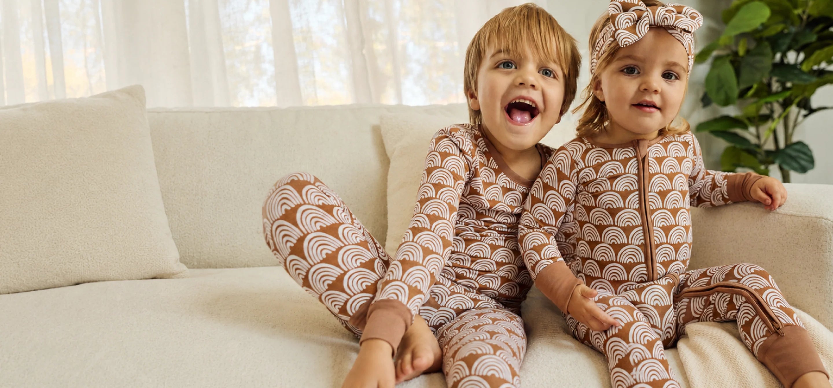 Children wearing rainbow pajamas