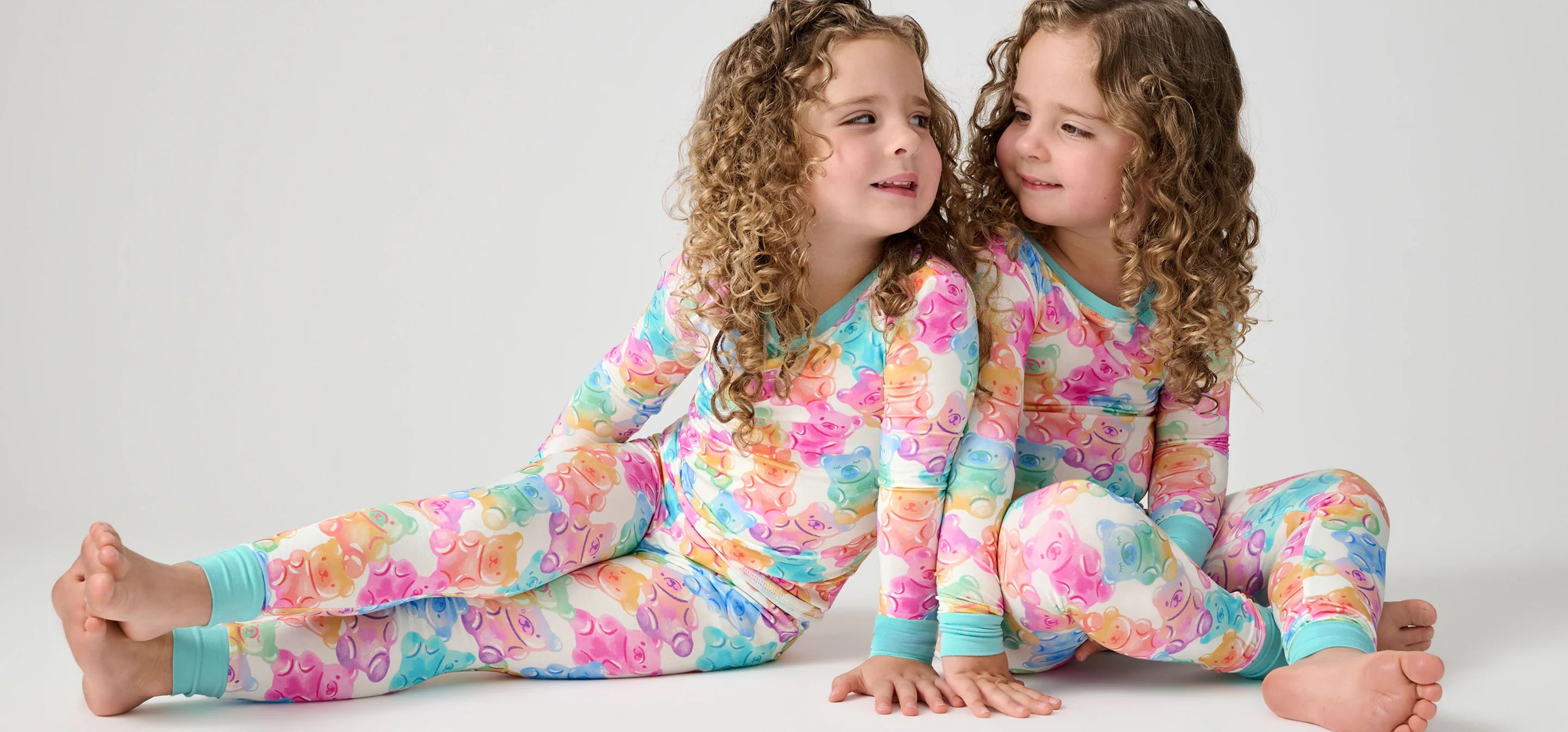 Children wearing colorful gummy pajamas